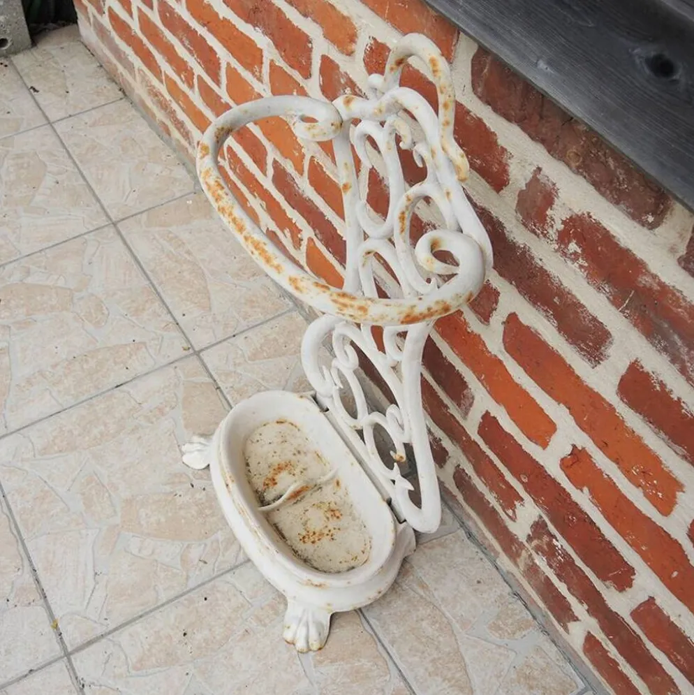 Ancien porte-parapluie en fonte émaillée blanche