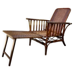 Chaise longue ancienne en rotin tressé avec repose-pieds