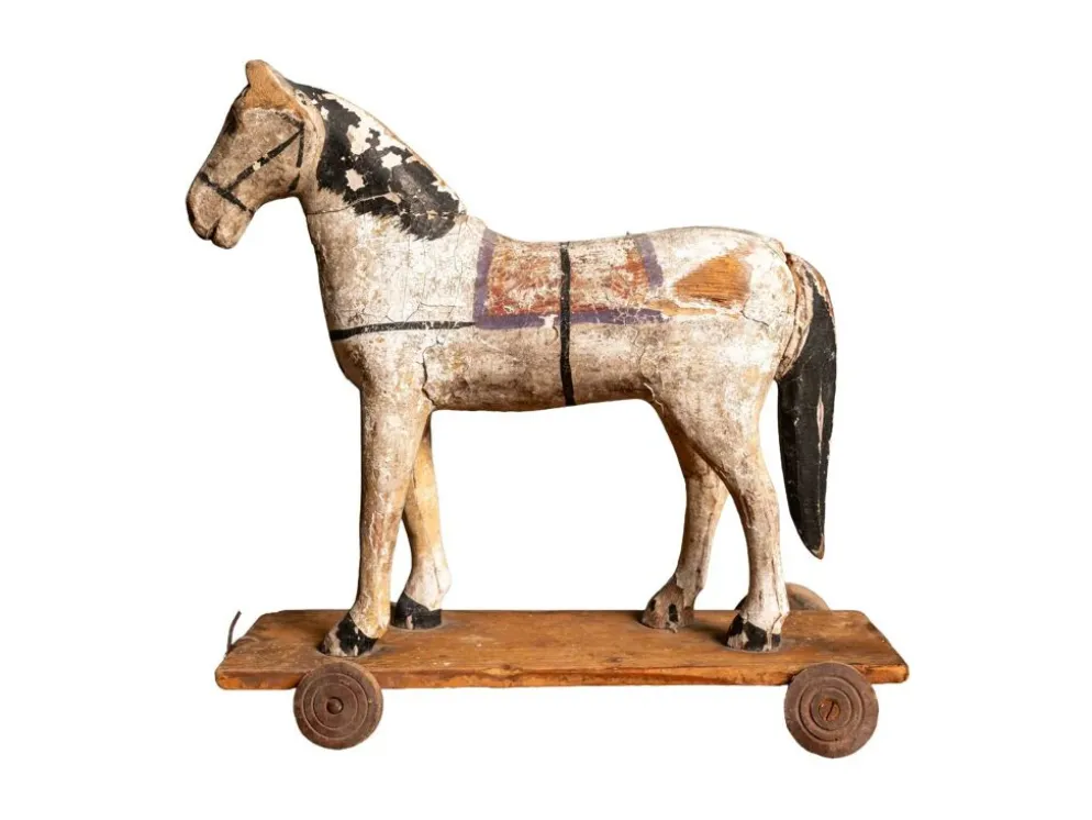 Cheval en bois ancien sur roues, début du 20e siècle