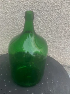 Dame jeanne en verre verte vintage