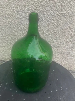 Dame jeanne en verre verte vintage