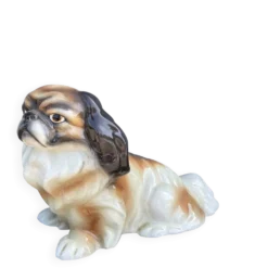 Goldscheider, chien pekingese en céramique