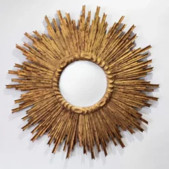 Grand miroir en soleil en bois sculpté et doré, années 1950