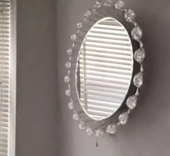 Grand miroir mural biseauté circulaire éclairé en lucite de glace fondue, années 1970