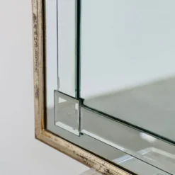 Grand miroir mural en verre biseauté de style Art Déco avec design d'arc architectural.