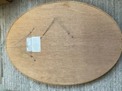 Grand miroir Ovale Deknudt en bois doré années 70