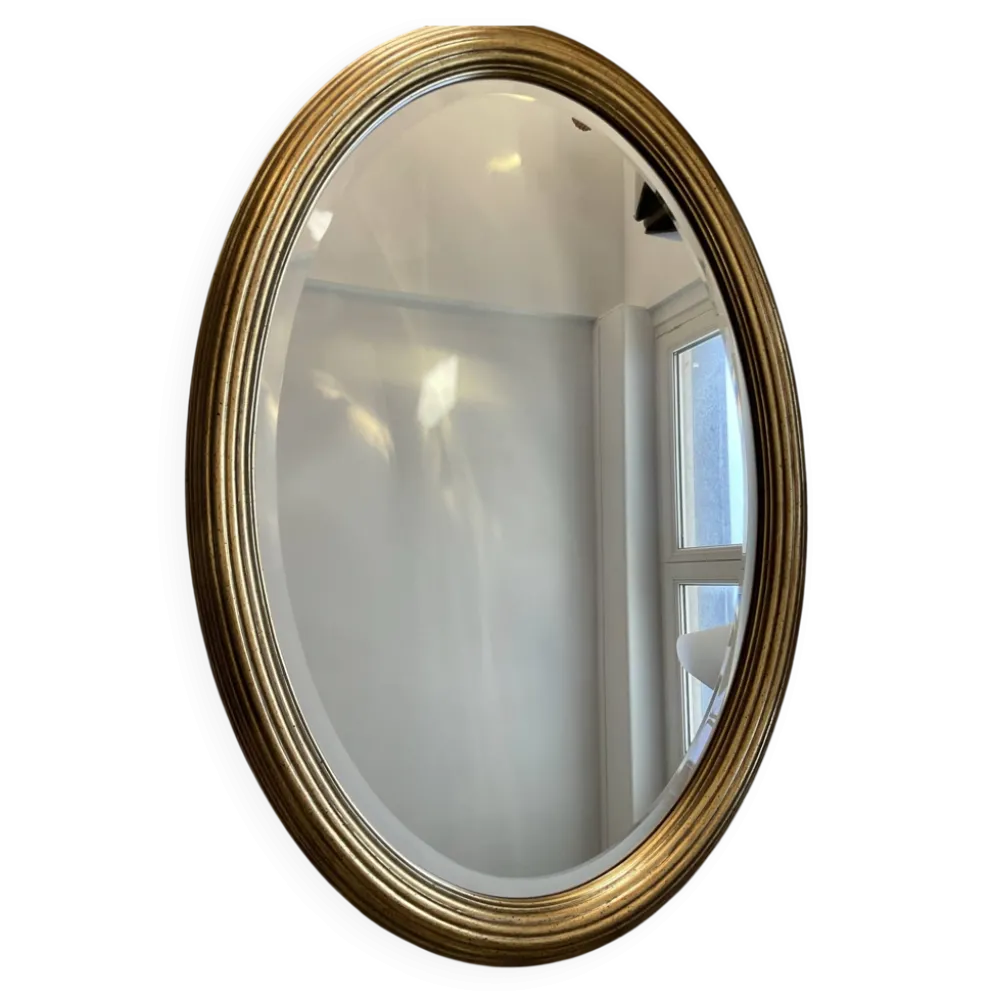 Grand miroir Ovale Deknudt en bois doré années 70