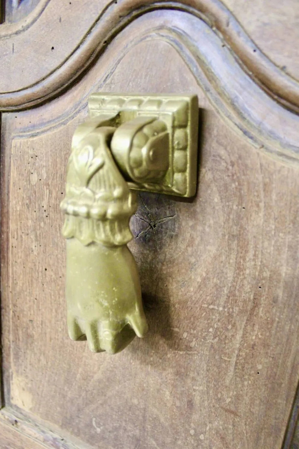 Heurtoir en bronze plein, forme de main, XIXème