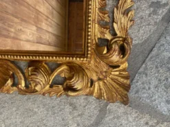 Miroir ancien en bois sculpté