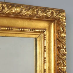 Miroir ancien en bois sculpté et doré, Italie, XXe siècle