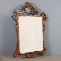 Miroir ancien en bois sculpté et doré, Italie, début XXe siècle