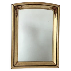 Miroir art déco en bois doré et cintré aux décorations florales