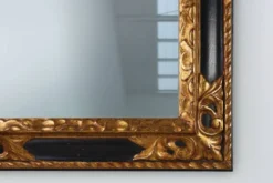 Miroir baroque en bois noir et doré sculpté, France années 1850.