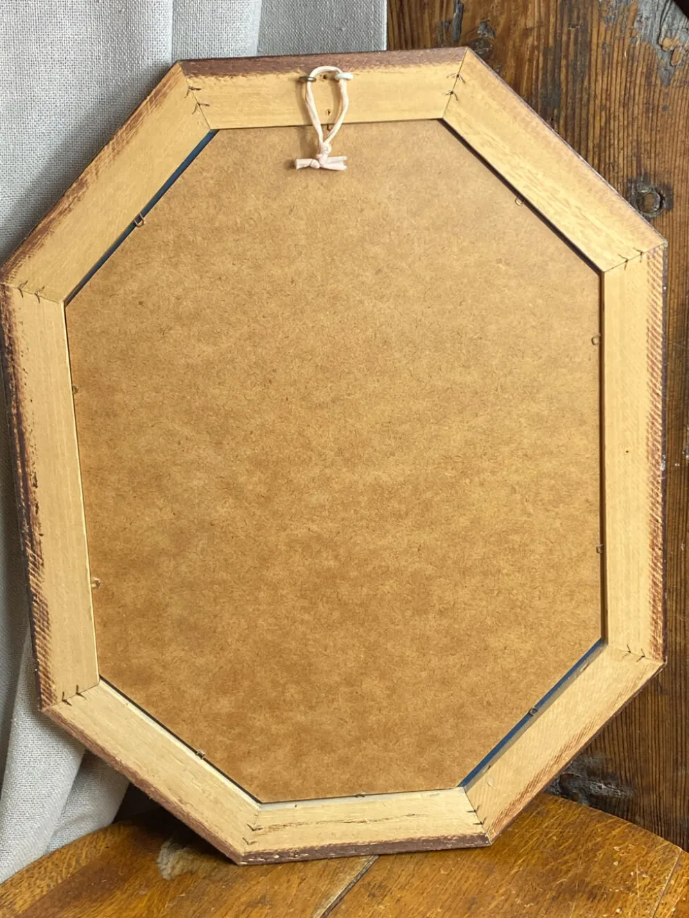 Miroir biseauté, de forme octogonale, en bois