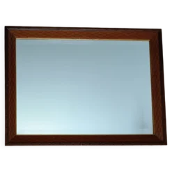 Miroir biseauté en bois sculpté et contour doré