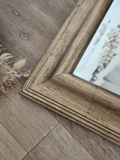Miroir biseauté sous cadre doré