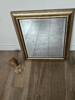 Miroir biseauté sous cadre doré