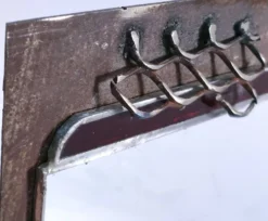 Miroir brutaliste métal et verre serti