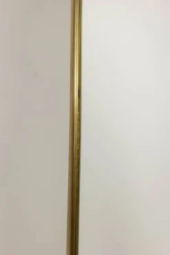 Miroir cerclé de laiton doré. 1980