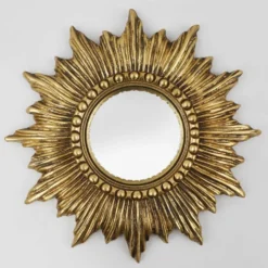 Miroir convexe en résine dorée en forme de soleil, France, années 1960.