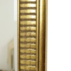 Miroir Deknudt en or Hollywood Regency biseauté 92 cm