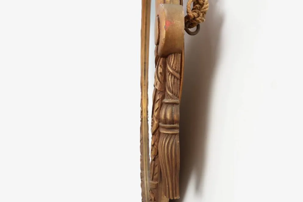 Miroir en chêne doré ovale français sculpté art déco, vers 1925