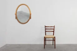 Miroir en chêne doré ovale français sculpté art déco, vers 1925