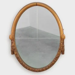 Miroir en chêne doré ovale français sculpté art déco, vers 1925
