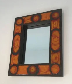 Miroir en céramique dans les tons orangés