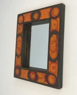 Miroir en céramique dans les tons orangés
