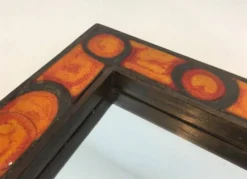 Miroir en céramique dans les tons orangés