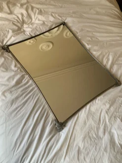 Miroir en metal argenté bord incurvé