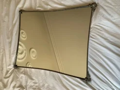 Miroir en metal argenté bord incurvé