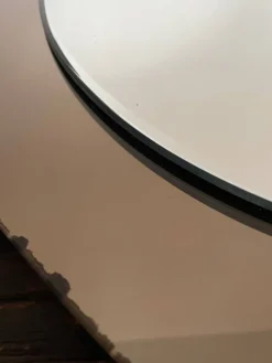 Miroir en verre fumé bicolore, vers 1970