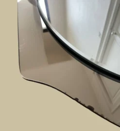 Miroir en verre fumé bicolore, vers 1970