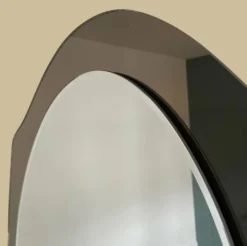 Miroir en verre fumé bicolore, vers 1970