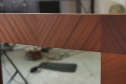 Miroir moderniste en placage d'acajou 1950's