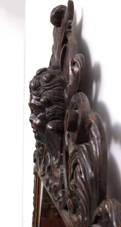 Miroir monumental ancien du XVIIIe siècle en chêne, orné d'un chérubin, de Hollande.