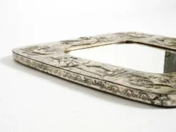 Miroir mural de style mid-century moderne avec un cadre en argent.