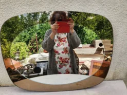 Miroir mural forme libre fumé bronze, années 1970