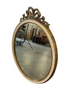 Miroir mural ovale baroque vintage à décor de noeud