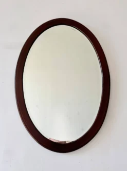 Miroir mural ovale en acajou ancien