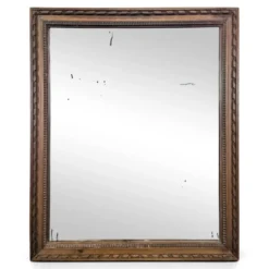Miroir Napoléon III à cadre en bois sculpté et doré