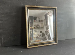 Miroir Napoléon III en bois noir et doré, XIXe siècle