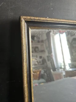 Miroir Napoléon III en bois noir et doré, XIXe siècle