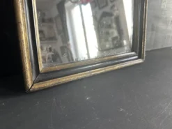 Miroir Napoléon III en bois noir et doré, XIXe siècle