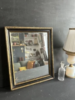 Miroir Napoléon III en bois noir et doré, XIXe siècle