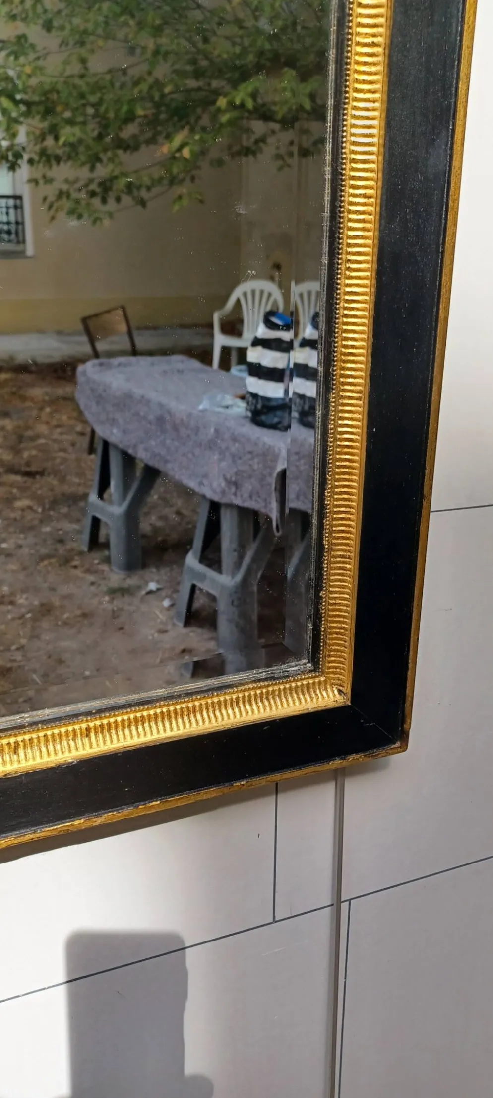 Miroir noir et dore de style art deco