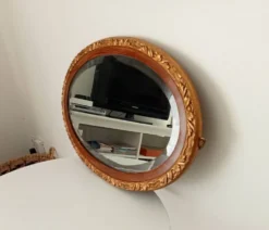 Miroir ovale ancien glace biseauté en bois et stuc XIXeme