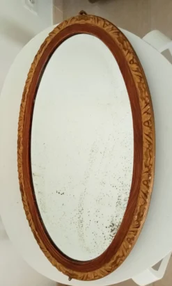 Miroir ovale ancien glace biseauté en bois et stuc XIXeme